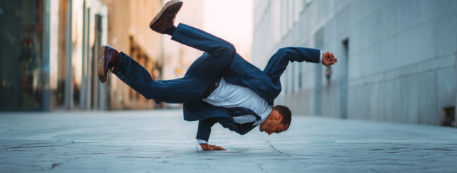 Enthusias1 Abusinessman in a suit breakdancing on the street 6e7312fb d702 4be6 9a7a 097a1f961f41 0
