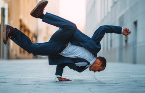 Enthusias1 Abusinessman in a suit breakdancing on the street 6e7312fb d702 4be6 9a7a 097a1f961f41 0