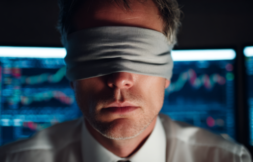 Enthusias A financial analyst sitting blindfolded in front of 3fbd70cd 114c 435d 8c85 05b060ed7258 2