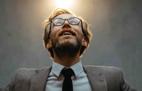 Enthusias A man in a business suit having a eureka moment f4322e71 1ddb 40ff bc55 981eff749c0a 2